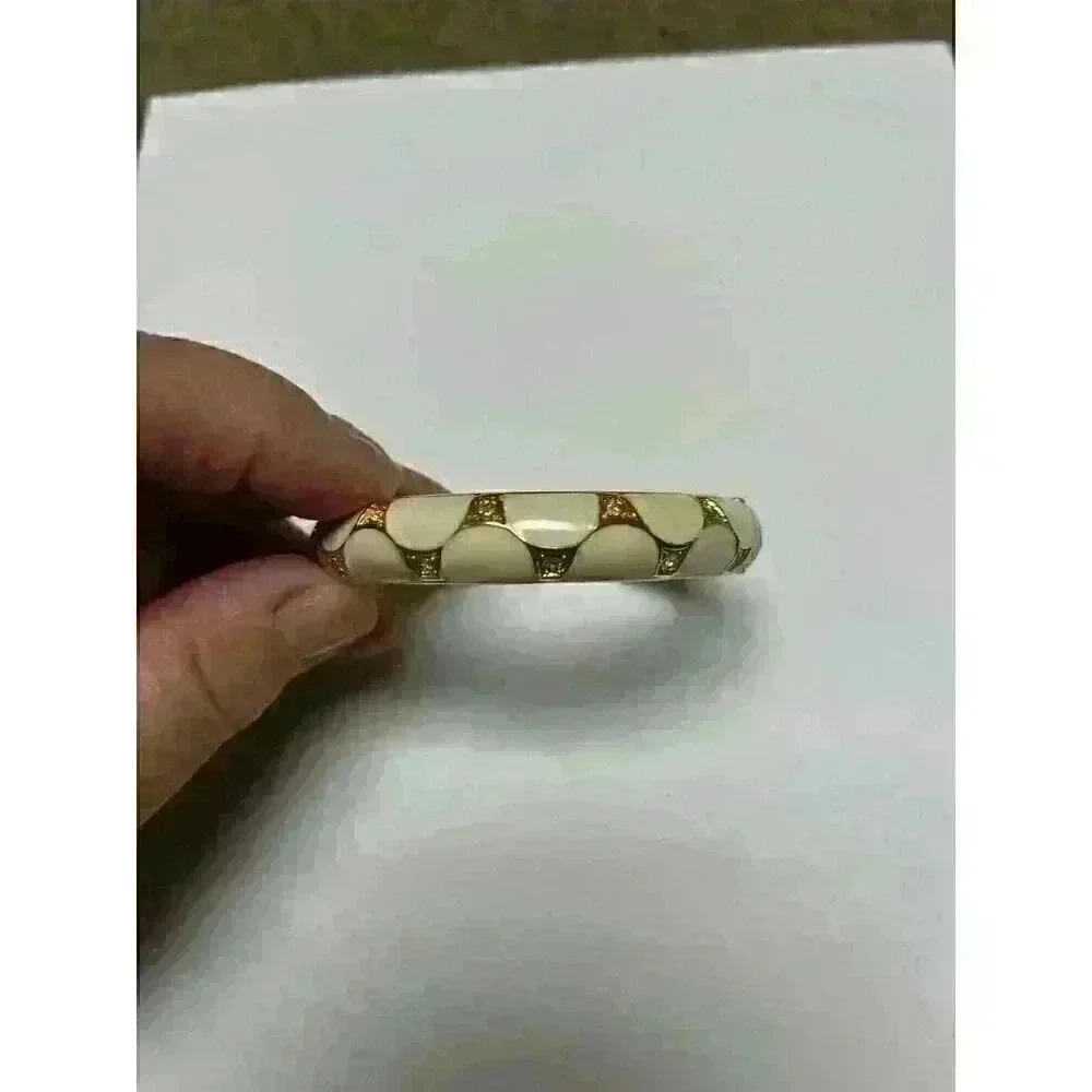 White enamel‎ bracelet with gold/rhinestone accents